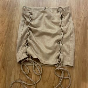 Suede lace up skirt.